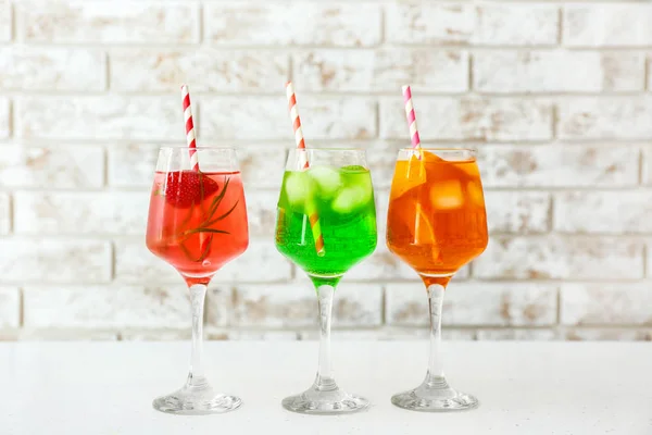 Glasses of tasty summer cocktails on table — Stock Photo, Image