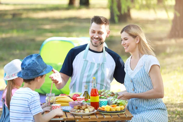 Happy family having picnic on summer day — Stock Photo, Image