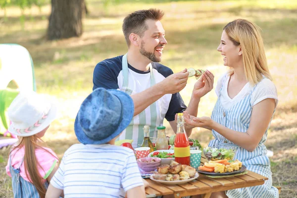 Happy family having picnic on summer day — Stock Photo, Image