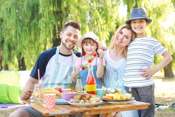 Happy family having picnic on summer day — Stock Photo, Image