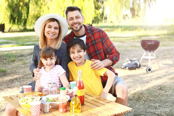 Happy family having picnic on summer day — Stock Photo, Image