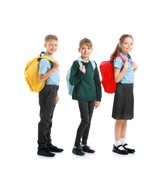 Carino piccoli alunni su sfondo bianco — Foto Stock