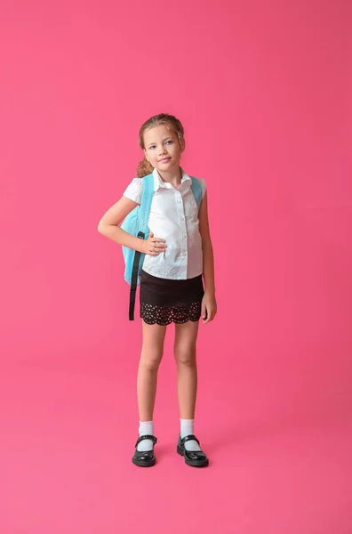 Cute little schoolgirl on color background — Stock Photo, Image