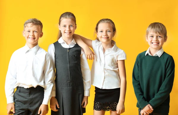 Cute little pupils on color background — Stock Photo, Image