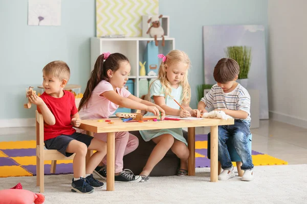 Cute little children playing in kindergarten — Stock Photo, Image