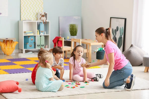 Cute little children learning letters in kindergarten — Stock Photo, Image