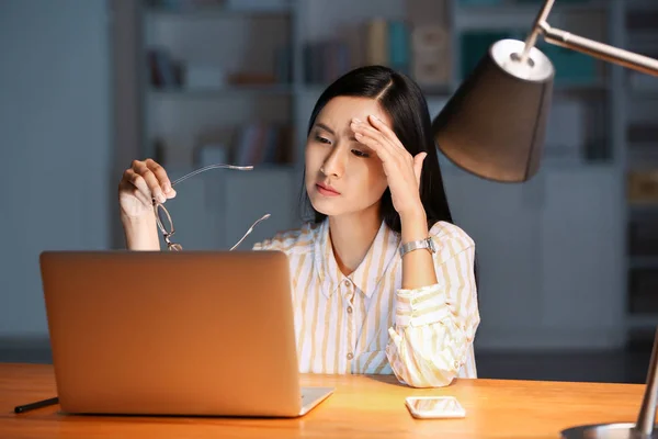Tired Asian student preparing for exam in evening — Stock Photo, Image