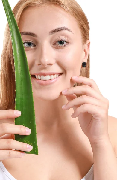 Beautiful young woman with aloe vera on white background — Stock Photo, Image