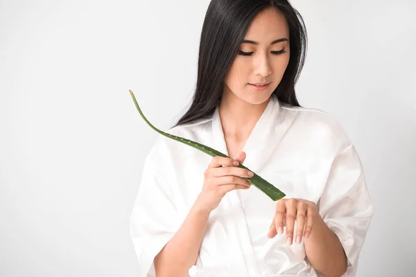 Beautiful Asian woman with aloe vera on white background — Stock Photo, Image