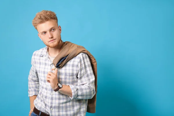 Stylish young man on color background — Stock Photo, Image