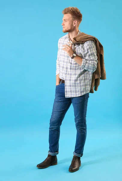 Stylish young man on color background — Stock Photo, Image