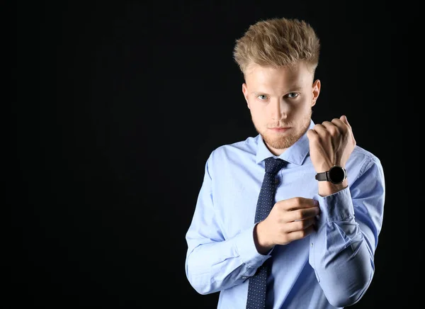 Stylish young man in formal clothes on dark background — Stock Photo, Image