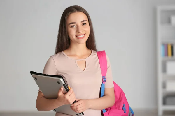 Young female student with laptop at home — Stock Photo, Image
