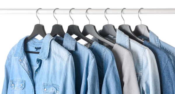 Rack with hanging clothes on white background — Stock Photo, Image