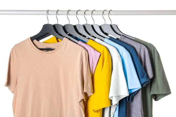 Rack with hanging clothes on white background — Stock Photo, Image