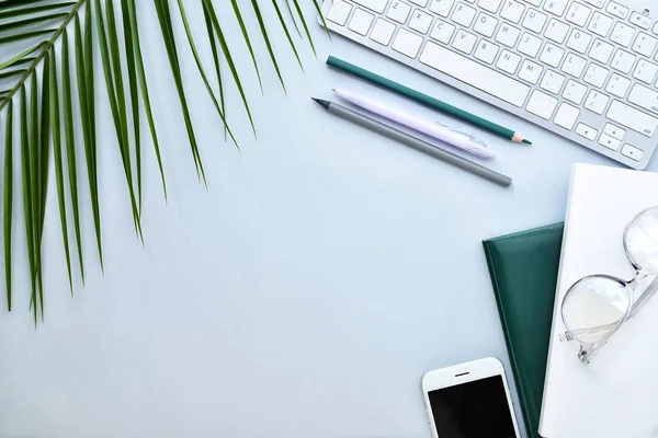 Composition with stationery, mobile phone and computer keyboard on grey background — Stock Photo, Image