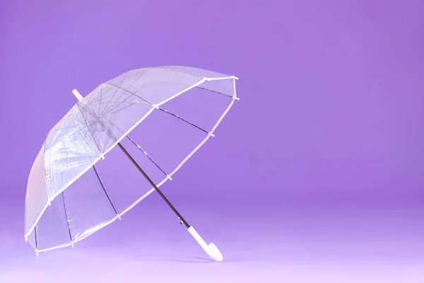 Stylish umbrella on color background — Stock Photo, Image