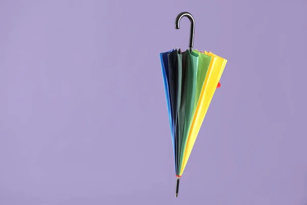 Stylish umbrella on color background — Stock Photo, Image