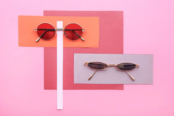 Stylish sunglasses on color background — Stock Photo, Image