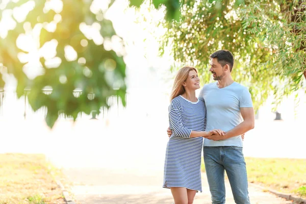 Happy couple in love walking outdoors — Stock Photo, Image