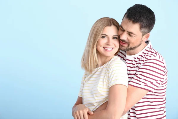 Portrait of happy couple in love on light background — Stock Photo, Image