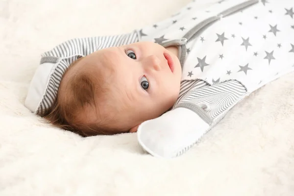 Cute little baby lying on bed at home — Stock Photo, Image