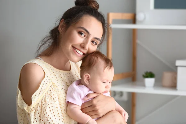 Happy mother with cute little baby at home — Stock Photo, Image