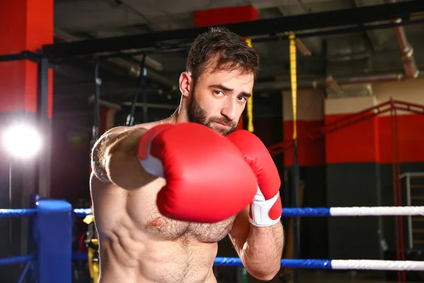 Sporty man in boxing ring