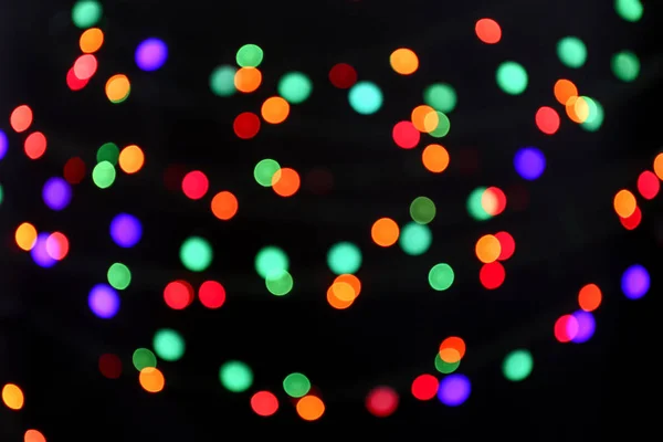 Colorful defocused lights on dark background — Stock Photo, Image