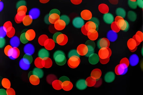 Colorful defocused lights on dark background — Stock Photo, Image