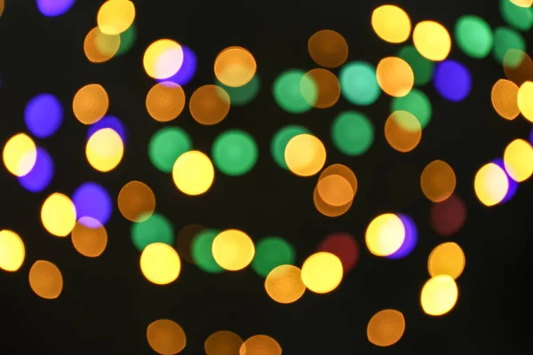 Colorful defocused lights on dark background — Stock Photo, Image