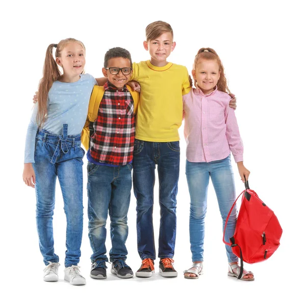 Söta små elever på vit bakgrund — Stockfoto