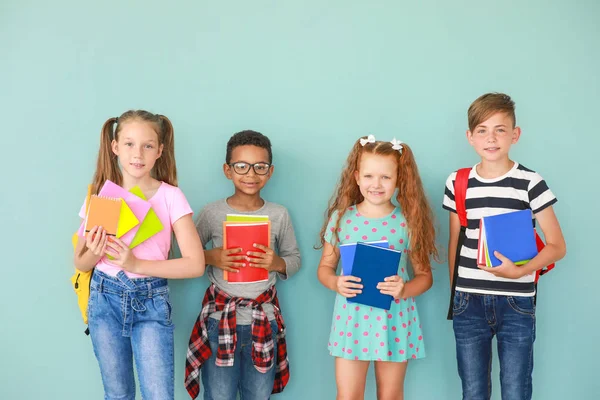 Cute little pupils on color background — Stock Photo, Image