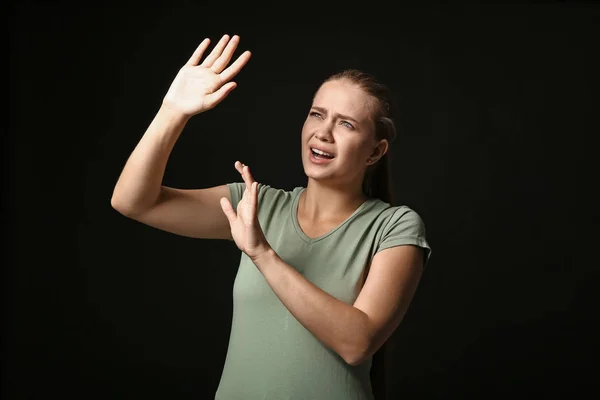 Woman having panic attack on dark background — Stock Photo, Image