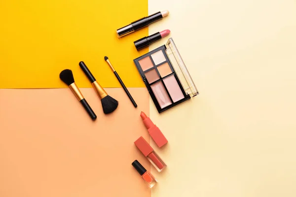 Set of makeup cosmetics on color background — Stock Photo, Image