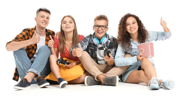 Teenagers playing video game on white background — Stock Photo, Image