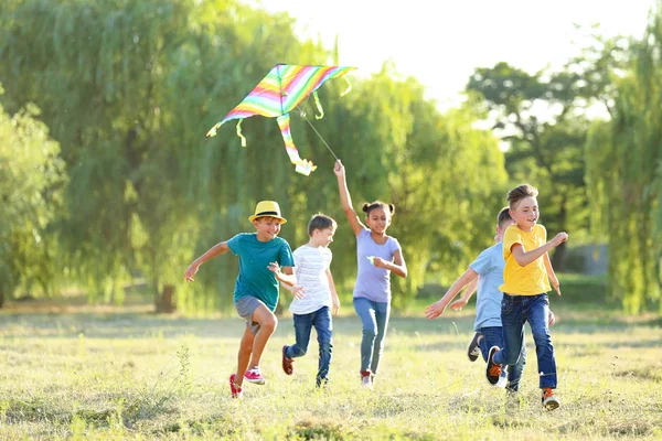 Children flying kite on summer day — Stock Photo, Image