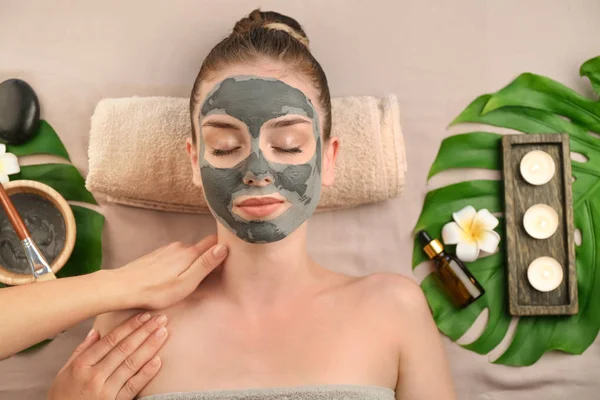 Beautiful young woman relaxing in spa salon, top view — Stock Photo, Image