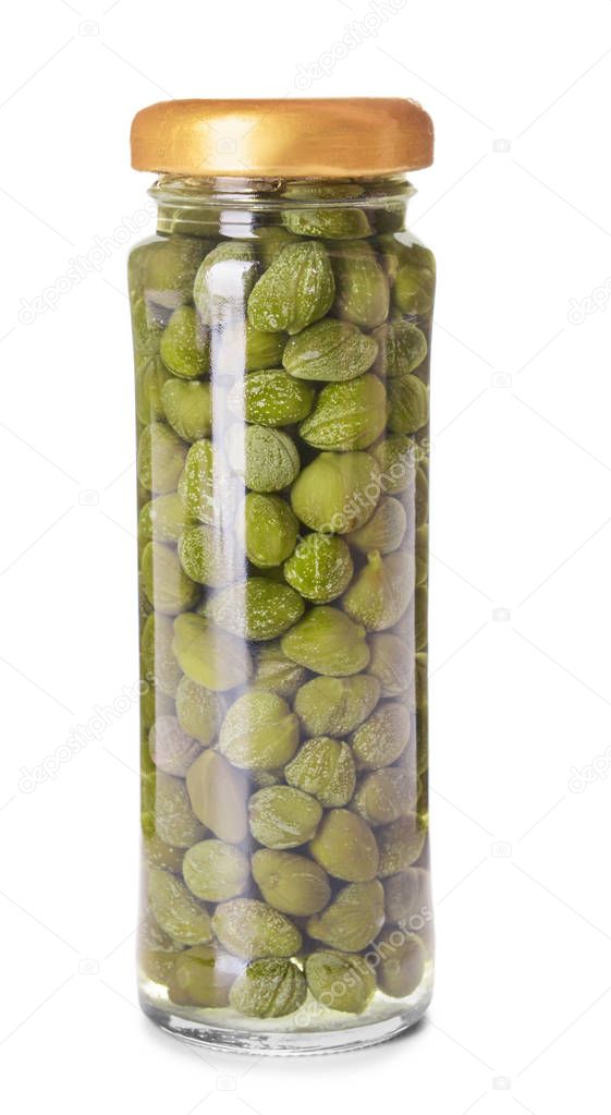 Jar with canned capers on white background