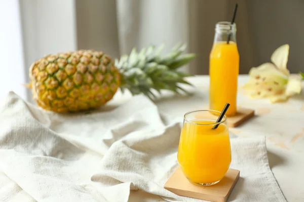 Glass of tasty pineapple juice on table — Stock Photo, Image