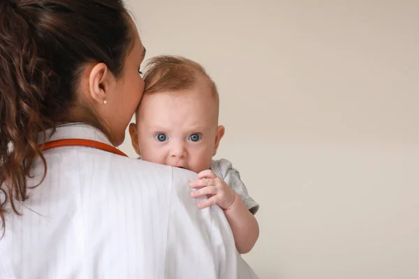 Pediatrician with cute little baby in clinic — Stock Photo, Image