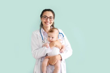 Pediatrician with cute little baby on color background clipart