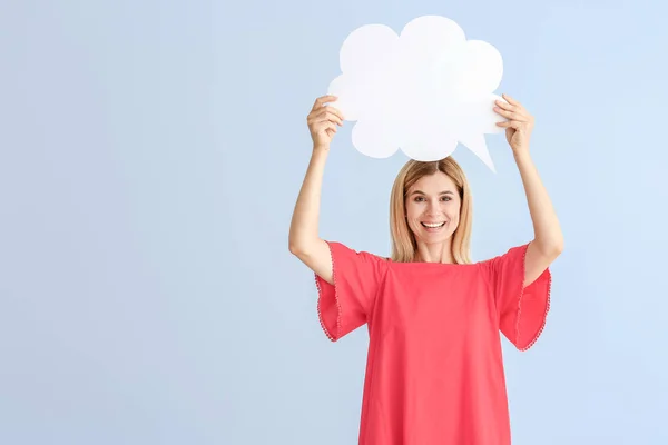 Happy woman with speech bubble on color background — Stock Photo, Image