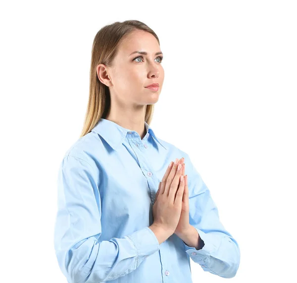 Religious young woman praying on white background — Stock Photo, Image