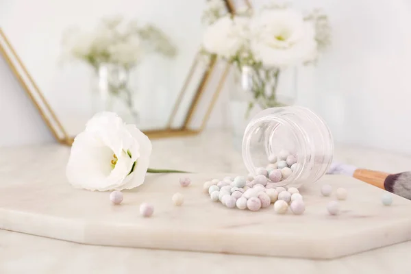 Jar with powder pearls on board — Stock Photo, Image
