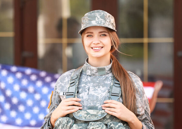 Happy young female soldier  outdoors