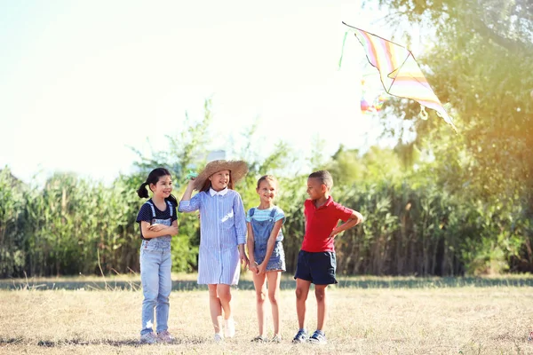 Little children flying kite outdoors — Stock Photo, Image