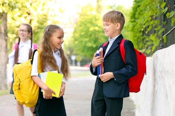 Cute little pupils after classes outdoors — Stock Photo, Image