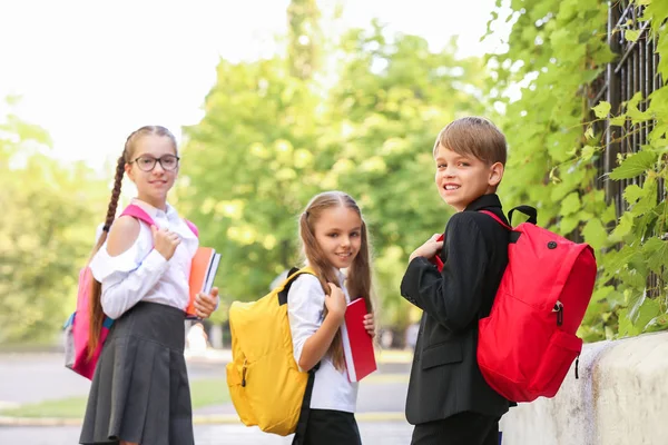 Cute little pupils after classes outdoors — Stock Photo, Image