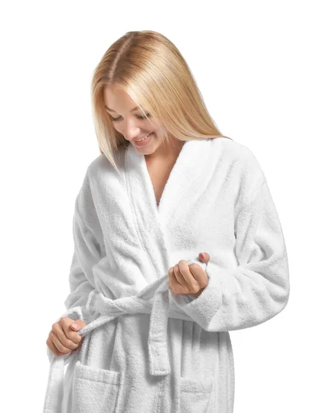 Beautiful young woman in bathrobe on white background — Stock Photo, Image